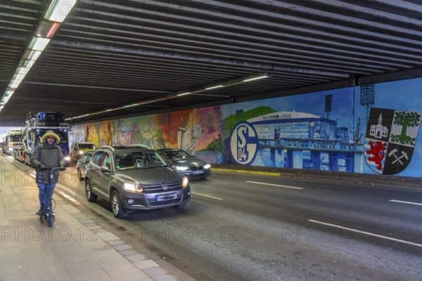 Huge street art pictures in a road tunnel in Gelsenkirchen, the approximately 120 meter long railway underpass of Wickingstraße was extensively painted and sprayed on both sides by 11 Gelsenkirchen graffiti artists and collectives, over a total length of 174 meters, the wall paintings showed motifs from Gelsenkirchen history, from economy, coal, steel, soccer, Schalke 04, culture, life, to the 150.year-old city Anniversary on 29.11.25, North Rhine-Westphalia, Germany