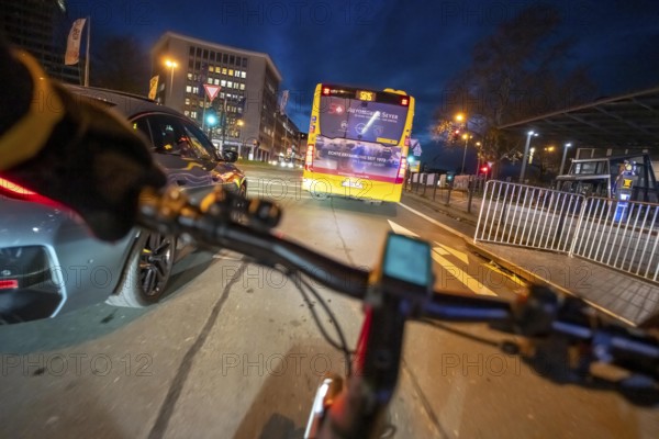 Cycling in the city, in the dark, in the evening, cycling underpass at the main train station, in downtown Essen, North Rhine-Westphalia, Germany