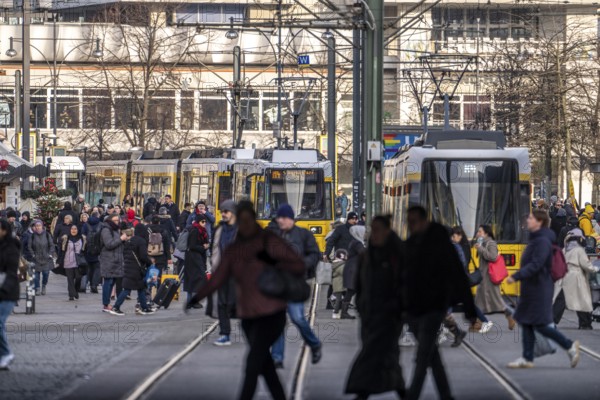 Trams at Alexanderplatz in Berlin, passers-by, Germany
