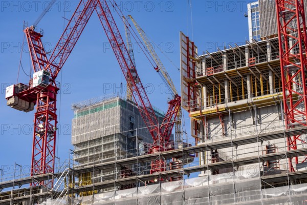 Construction site of the Covivio skyscraper in front, in the vicinity of Alexanderplatz in Berlin, mixed use of apartment, offices, retail and a daycare center, the high-rise construction site of The Berlinian office high-rise building in the back, Germany