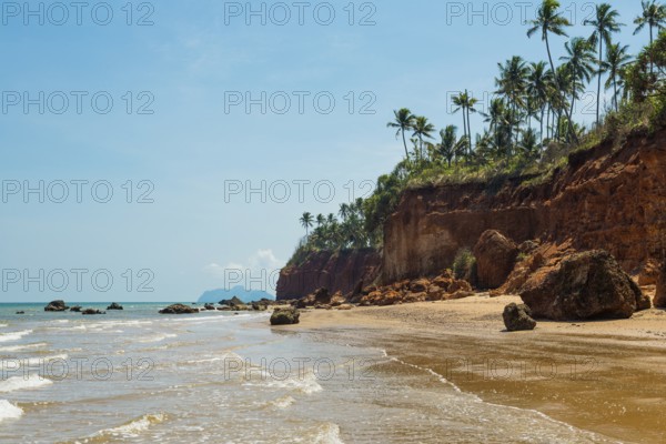 Lonely beach with red rocks and coconut trees, Red Cliffs, Bang Saphan Noi, Prachuap Khiri Khan Province, Central Thailand, Thailand