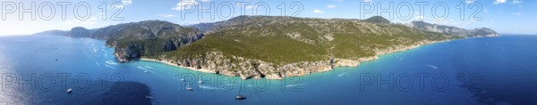 Panorama, picturesque rocky coast, cliffs and Cala Luna beach, aerial view, Golfo di Orosei, Baunei, Sardinia, Italy