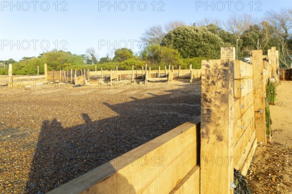 Temporary coastal defences erected by Bawdsey Haven Yacht Club, response to rapid erosion beach depletion, River Deben, Bawdsey, Suffolk, England, UK Nov 2025