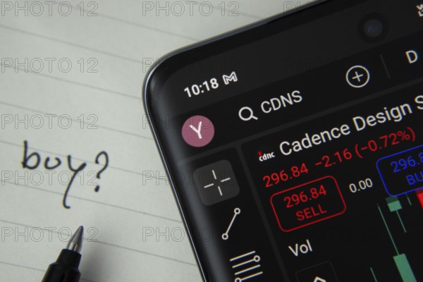 Dhaka, Bangladesh- 20 June 2025: Cadence design systems stock trading details displayed on smartphone with handwritten note