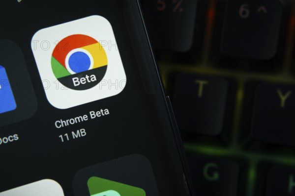 Dhaka, Bangladesh- 27 July 2025: Close-up of smartphone screen showing the Google Chrome Beta app icon with a dark interface