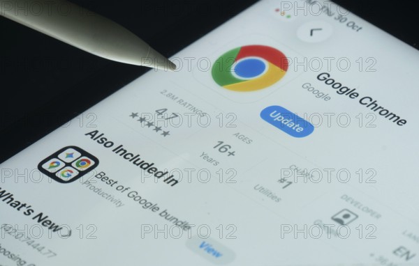 Dhaka, Bangladesh- 30 Oct 2025: Google Chrome app on a iPad screen with a pen pointing at the install option