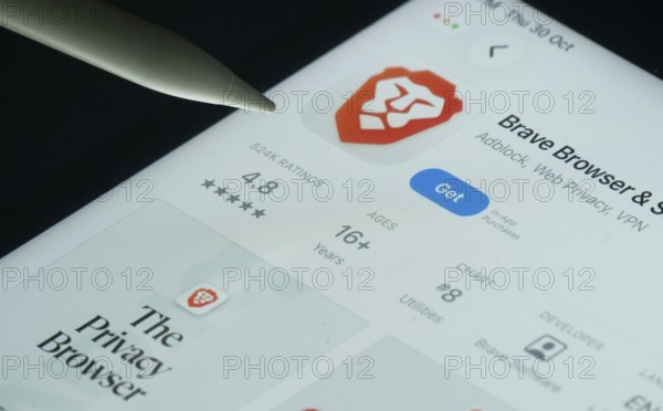 Dhaka, Bangladesh- 30 Oct 2025: Brave browser app on a iPad screen with a pen pointing at the install option