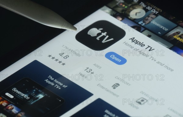 Dhaka, Bangladesh- 30 Oct 2025: Apple TV app on a iPad screen with a pen pointing at the install option