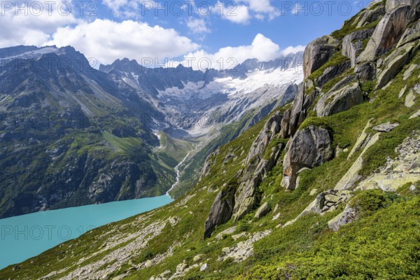Turquoise blue mountain lake Göscheneralpsee, picturesque mountain landscape with dammastock and damma glacier, Göscheneralp, Canton of Uri, Switzerland