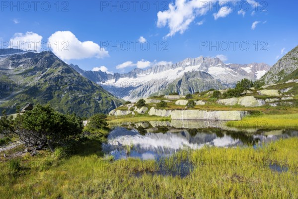 Picturesque mountain landscape, dammastock and damma glaciers reflected in Moorsee, Göscheneralp, Canton of Uri, Switzerland