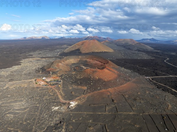 Montaña Quemada and Montaña Pedro Perico volcanoes, volcanic landscape with craters and lava fields, aerial view, Lanzarote, Canary Islands, Spain