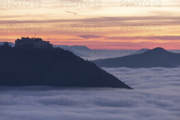 Sunset over the sea of fog from Beurener Fels to Hohenneuffen Castle, Swabian Alb, Baden-Württemberg, Germany