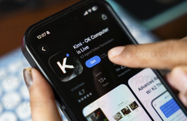 In this photo illustration, a person uses the Kimi AI chatbot on a smartphone, in New Delhi, India on 20 November 2025. Kimi AI is a Chinese artificial intelligence chatbot and assistant developed by Moonshot AI, a fast-growing tech company in China