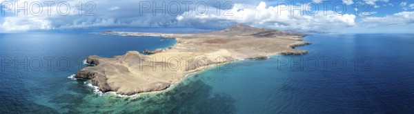 Headland and blue sea, coastal landscape, arid landscape of Los Ajaches Natural Park, aerial view, Lanzarote, Canary Islands, Spain