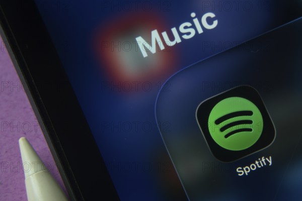 16 Nov 2025- Dhaka, Bangladesh: Close-up of Spotify app icons on a iPad screen