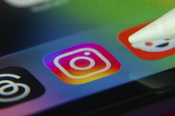 16 Nov 2025- Dhaka, Bangladesh: Stylus touching the Instagram app icon on a smartphone screen