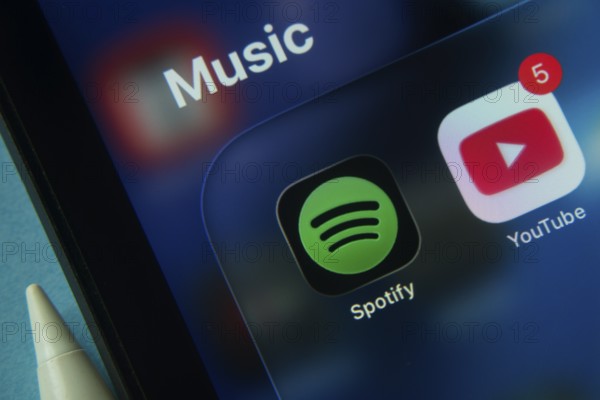 16 Nov 2025- Dhaka, Bangladesh: Close-up of Spotify and Youtube app icons on a iPad screen