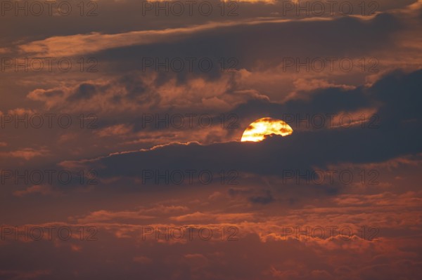 Dramatic sunset with clouds and sun, Etosha National Park, Namibia
