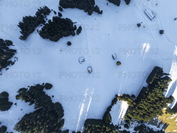 Wonderful winter landscape with Hohe Salve, blue sky and snow, mountains and mountain valley, aerial view of Skiwelt Wilder Kaiser ski area, Brixental, Tyrol, Austria