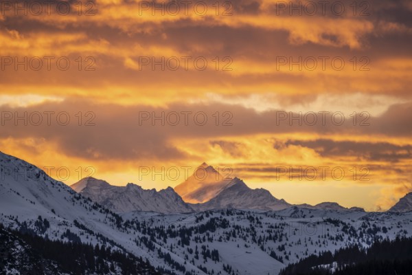 Grossglockner peaks at sunset in winter, spectacular cloudy skies, Hochbrixen, Brixen im Thale, Tyrol, Austria