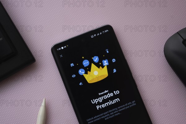 Dhaka, bangladesh- 16 March 2025: A smartphone screen featuring the upgrade to premium Truecaller