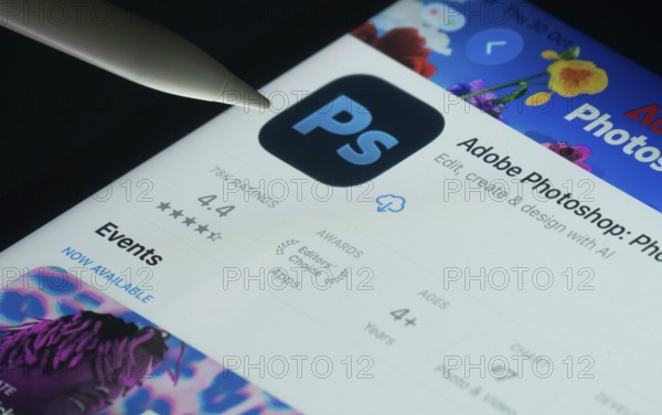Dhaka, Bangladesh- 30 Oct 2025: Adobe Photoshop app on a iPad screen with a pen pointing at the install option