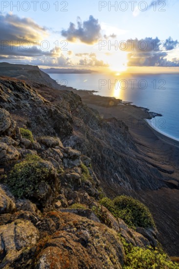 View of steep cliffs on sea and coast, Mirador del Porrito viewpoint at sunset, Lanzarote, Canary Islands, Spain