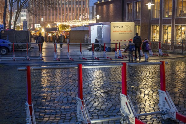 Christmas market in Essen, secured by mobile anti-terrorist lock, modular, movable barrier against car and truck shooting, are opened or closed by a security guard as required, model Herner Truck Lock, HTS, on Kennedyplatz, in Essen, North Rhine-Westphalia, Germany