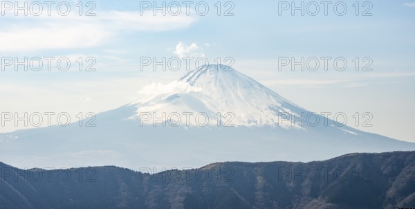Snow-covered summit of Mount Fuji volcano in spring, Owakudani, Hakone, Japan