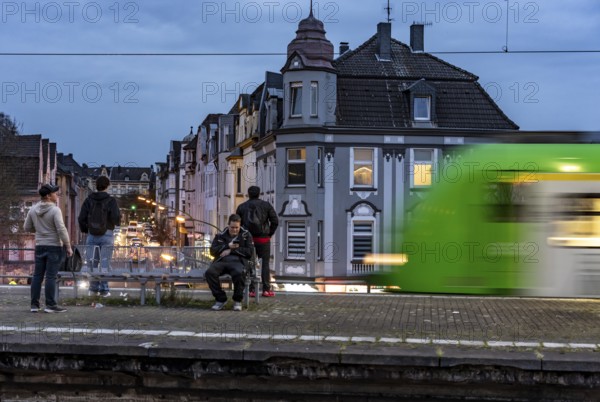Essen-Steele S-Bahn station, passengers waiting for the train late afternoon, in autumn, Essen, North Rhine-Westphalia, Germany