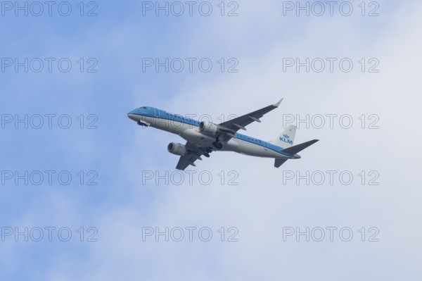 Embraer ERJ-190 jet passenger aircraft of Royal Dutch KLM cityhopper airlines in flight on approach to London city airport, England, United Kingdom