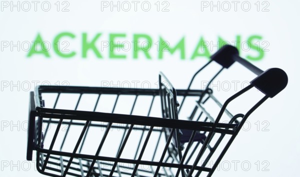 Dhaka, Bangladesh- 03 July 2025: Silhouette of a shopping cart in front of the Ackermans logo, symbolizing ecommerce and online shopping