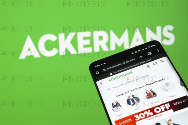 Dhaka, Bangladesh- 03 July 2025: Smartphone displaying Ackermans web interface against Ackermans logo background
