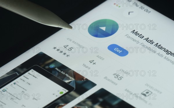 Dhaka, Bangladesh- 30 Oct 2025: meta ads manager app on a iPad screen with a pen pointing at the install option