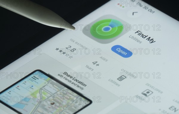 Dhaka, Bangladesh- 30 Oct 2025: Apple Find My app on a iPad screen with a pen pointing at the install option