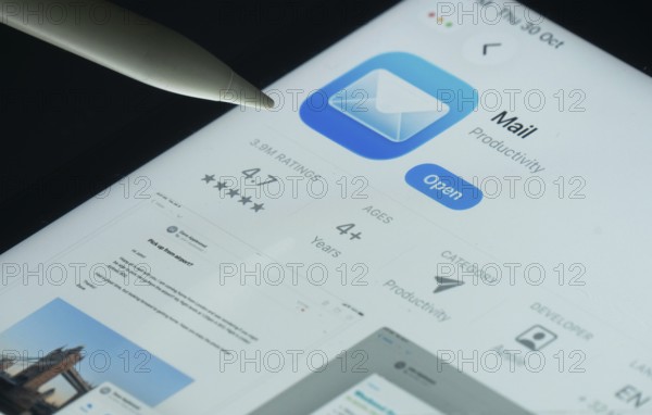 Dhaka, Bangladesh- 30 Oct 2025: Apple Mail app on a iPad screen with a pen pointing at the install option