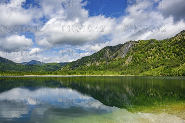 Landscape of Lake Offensee after rain when the sun comes through the clouds in spring, Salzkammergut, Austria