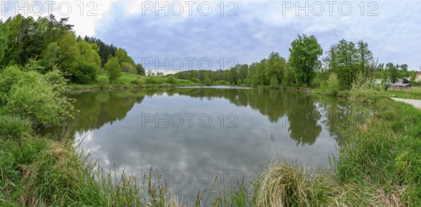 Landscape of a little lake on a cloudy day in spring, Upper Palatinate, Bavaria, Germany