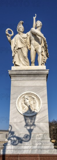 The shadow of a street lamp on the pedestals of the group of figures on the Schlossbrücke, Unter den Linden, Berlin, Germany