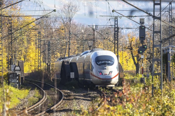 Intercity Express ICE. Open-route passenger train in the Stuttgart North Station area. Arched bridge and landscape in autumn. Stuttgart, Baden-Württemberg, Germany