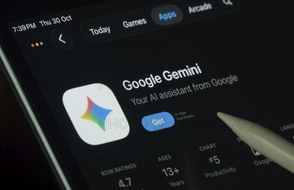 Dhaka, Bangladesh- 30 Oct 2025: Google Gemini app displayed on a iPad screen in dark mode with a digital pen pointing at it