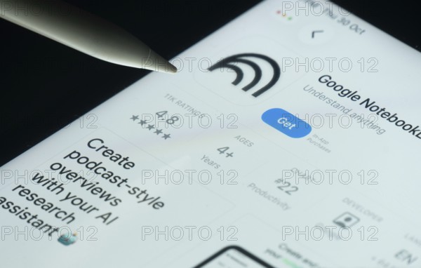 Dhaka, Bangladesh- 30 Oct 2025: Goole NotebookLM app on a iPad screen with a pen pointing at the install option