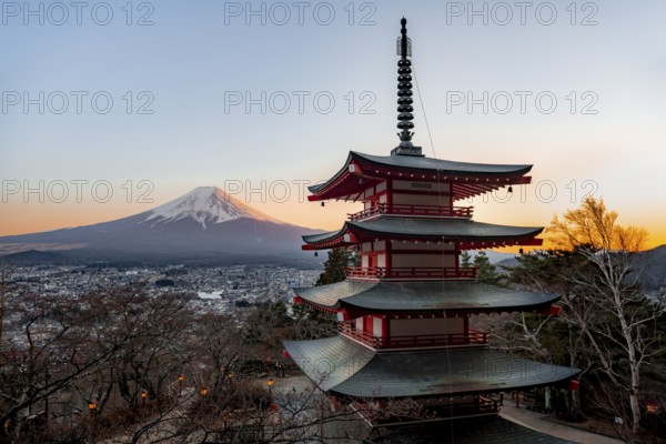 Five-story pagoda of a Shinto Shrine, Chureito Pagoda, with views of Fujiyoshida City and Mount Fuji volcano at sunset, Arakura Fuji Sengen Shrine, Arakurayama Sengen Park, Yamanashi Prefecture, Japan