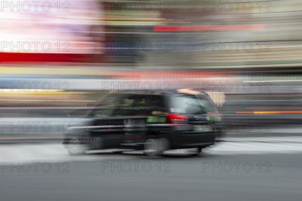 Black taxi driving, motion blur, long exposure, Shubuya Crossing, Shibuya, Tokyo, Japan