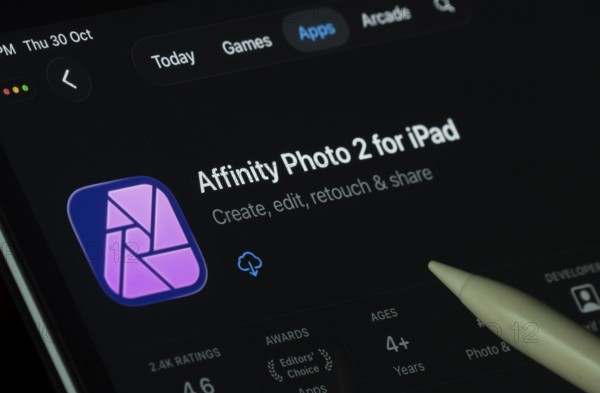Dhaka, Bangladesh- 30 Oct 2025: Affinity Photo 2 app displayed on a iPad screen in dark mode with a digital pen pointing at it