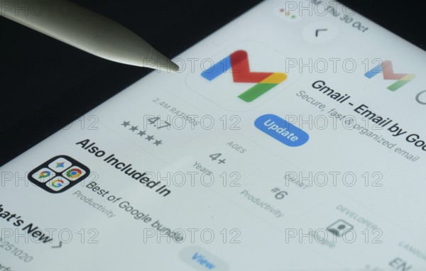 Dhaka, Bangladesh- 30 Oct 2025: Gmail app on a iPad screen with a pen pointing at the install option