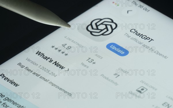 Dhaka, Bangladesh- 30 Oct 2025: ChatGPT app on a iPad screen with a pen pointing at the install option