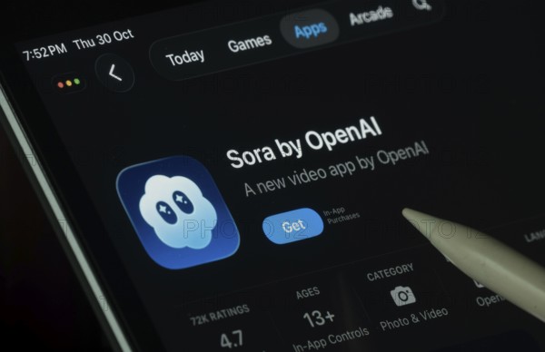 Dhaka, Bangladesh- 30 Oct 2025: Sora Ai app displayed on a iPad screen in dark mode with a digital pen pointing at it