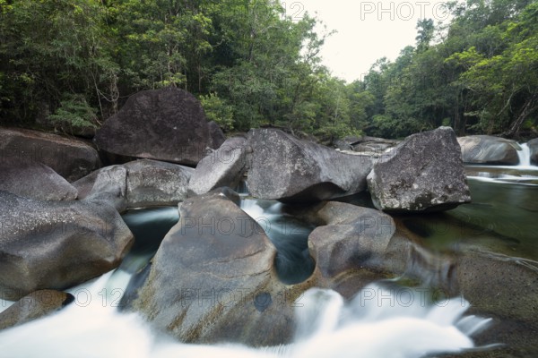 Turquoise blue water between rocks in the tropical rainforest of Babinda Boulders Queensland Australia