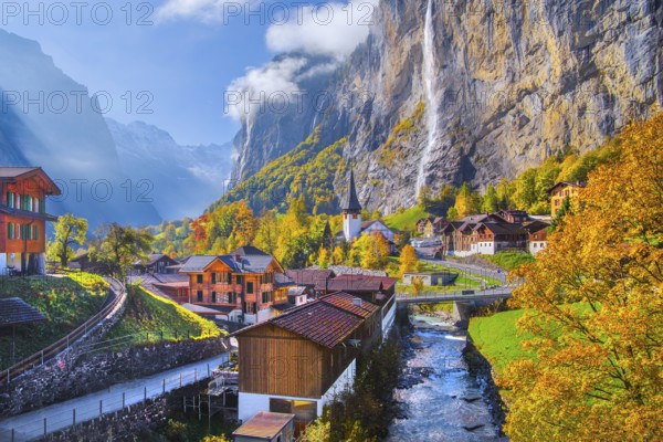 View of town and valley with Staubbach waterfall in autumn, Lauterbrunnen, Bernese Oberland, Canton of Bern, Switzerland